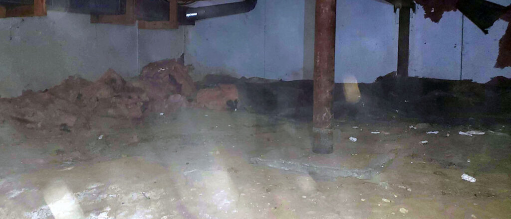 Photo of a crawlspace  before encapsulation services provided by Chem-Tech.